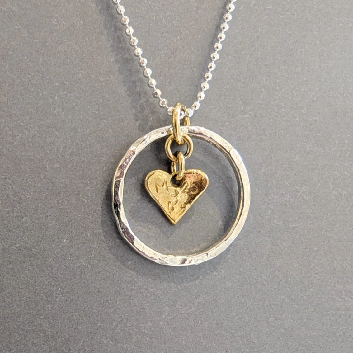 MH Sterling Silver Necklace - Circle with Gold Heart Pendant Close Up Reverse