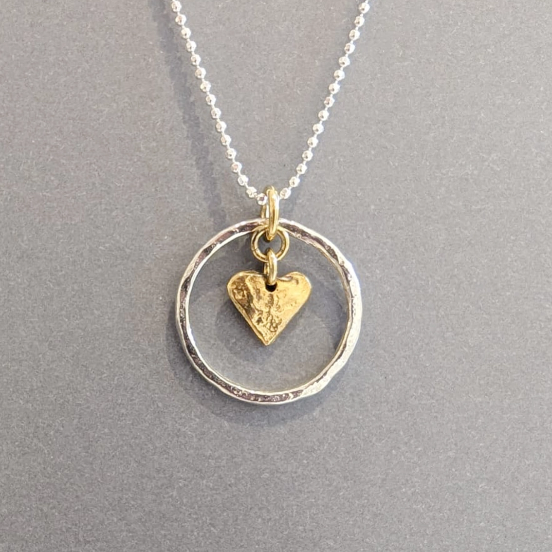 MH Sterling Silver Necklace - Circle with Gold Heart Pendant Close Up