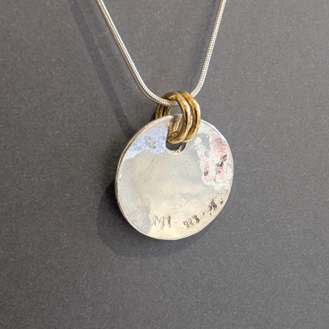 MH Sterling Silver Necklace - Disc with Gold Jump Rings Pendant Close Up Reverse